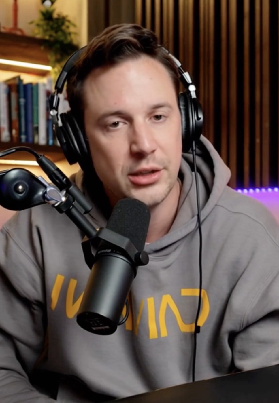 Jeff "Too Tall" Dick speaking into a microphone